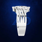 A silver-toned ring with a unique multi-prong setting and a clear round gemstone, shown on a dark textured blue background.