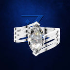 A silver ring featuring a large marquise-cut clear gemstone, set against a dark blue textured background with a subtle blue geometric logo.