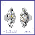 A pair of round brilliant-cut diamond stud earrings in a silver-toned setting, displayed on a white background with a blue border. The brand name 'PLATIZEM' is visible at the bottom.