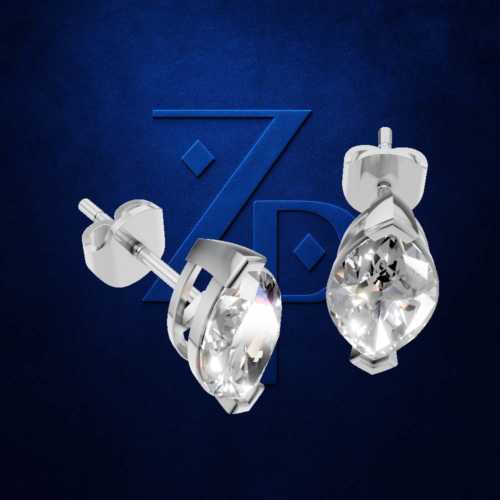 A pair of silver stud earrings with teardrop-shaped clear gemstones, shown from front and side angles against a textured dark blue background with a subtle stylized 'ZP' logo.
