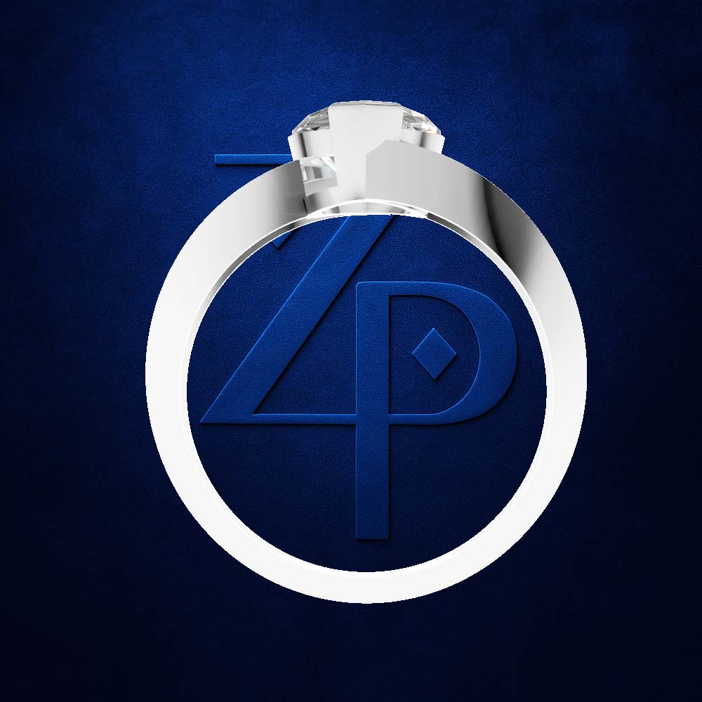 A silver-toned ring with a large oval face featuring a blue embossed monogram logo, photographed on a textured dark blue background.