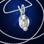 A silver-toned pendant necklace featuring a marquise-cut clear gemstone in a prong setting, suspended from a matching chain against a dark blue textured background with a large stylized '4' behind it.