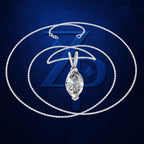 A silver-tone chain necklace with a marquise-cut clear gemstone pendant, displayed against a dark blue textured background with a large stylized 'Z' logo.