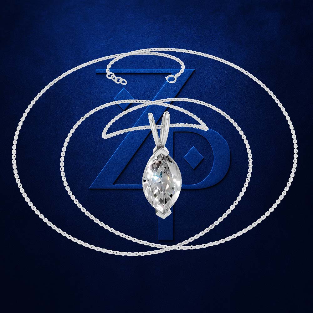A silver-tone chain necklace with a marquise-cut clear gemstone pendant, displayed against a dark blue textured background with a large stylized 'Z' logo.