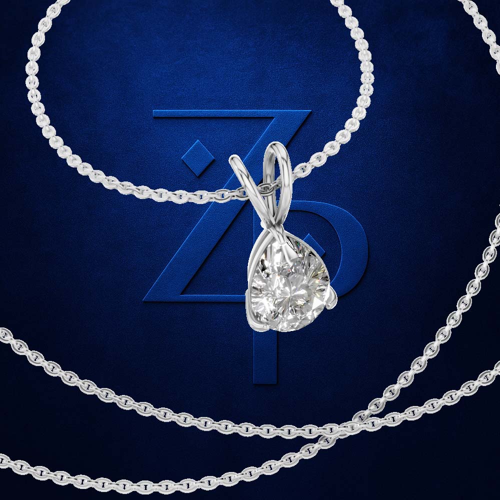 A silver-toned necklace with a teardrop-shaped clear gemstone pendant, shown against a dark blue textured background with a large stylized 'ZP' logo behind it.