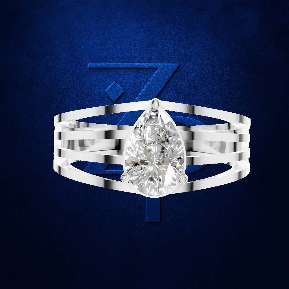 A silver-toned multi-band ring featuring a large pear-cut clear gemstone, presented against a textured dark blue background with a stylized blue 'Z' logo.