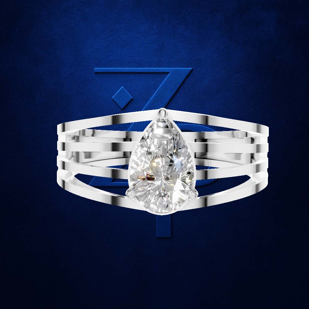 A silver-toned multi-band ring featuring a large pear-cut clear gemstone, presented against a textured dark blue background with a stylized blue 'Z' logo.