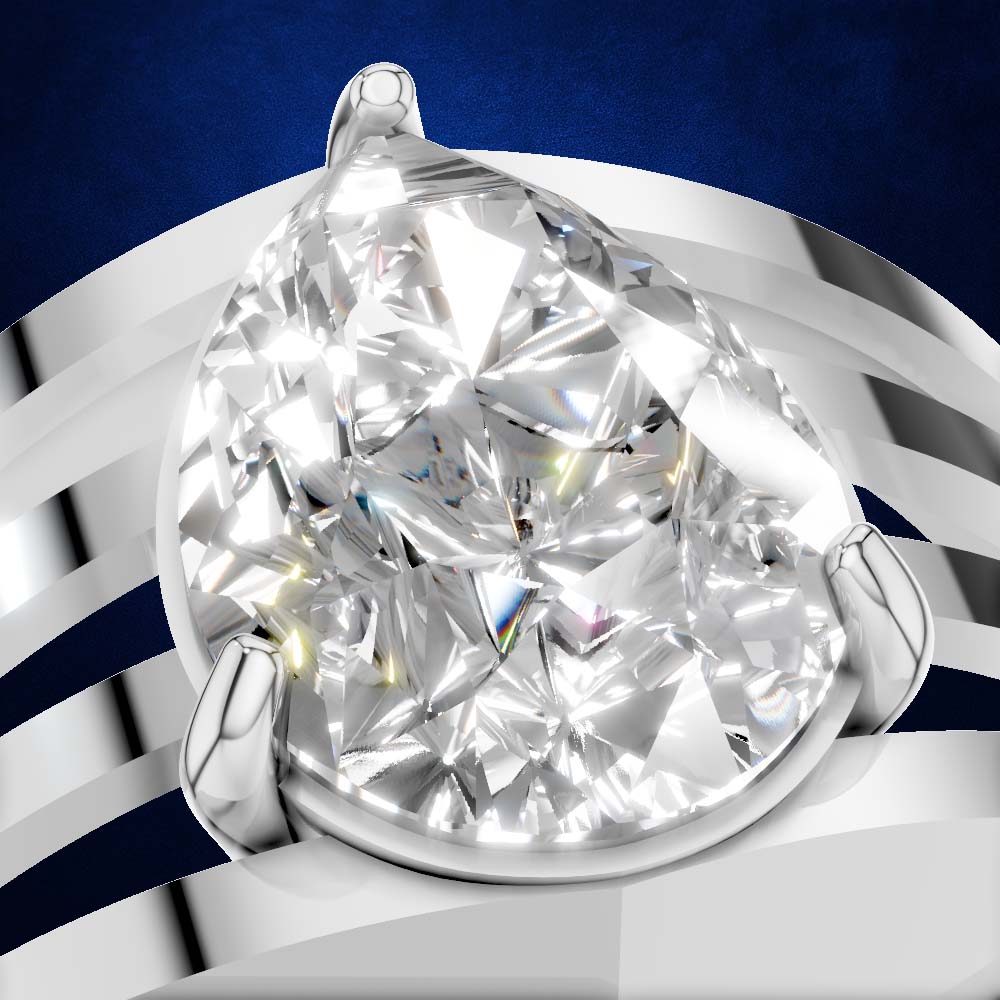 A pear-cut diamond ring set in a polished silver-toned band, shown in a close-up studio shot against a dark blue and white striped background.