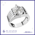 A silver-toned pear-cut diamond ring with a split band featuring parallel grooved stripes, presented on a white background with a blue border and the brand name 'PLATIZEM' at the bottom.