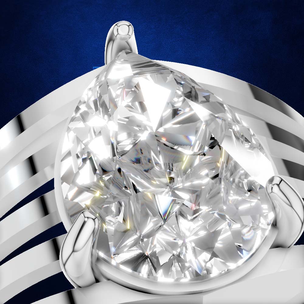 A close-up studio shot of a pear-cut diamond ring set in a polished silver-toned band, with the diamond centered against a deep blue background.