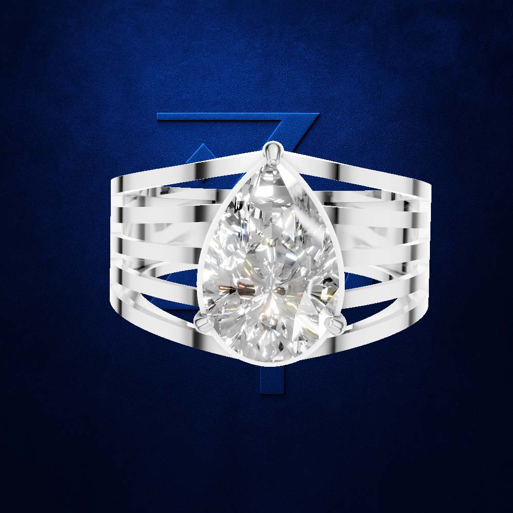 A silver-toned ring featuring a large pear-cut clear gemstone, shown against a dark blue textured background with a stylized blue Z logo behind it. Per the schema, clear gemstones do not contribute to the color mapping, so only the surrounding metal color is considered.
