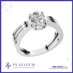 A silver-toned solitaire engagement ring with a round brilliant-cut diamond set in a high-profile crown, presented on a white background with a blue border and the Platizem brand logo at the bottom.