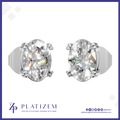 A pair of oval-cut diamond stud earrings in a silver-toned setting, shown from the front and side on a white background with the Platizem brand logo at the bottom.
