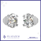 A pair of oval-cut diamond stud earrings in a silver-toned setting, shown from the front and side on a white background with the Platizem brand logo at the bottom.