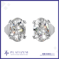 A pair of oval-cut diamond stud earrings in a silver-toned prong setting, shown from the front on a white background with a blue border. The brand name PLATIZEM is visible at the bottom.