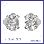 A pair of oval-cut diamond stud earrings in a silver-toned prong setting, shown from the front on a white background with a blue border. The brand name PLATIZEM is visible at the bottom.