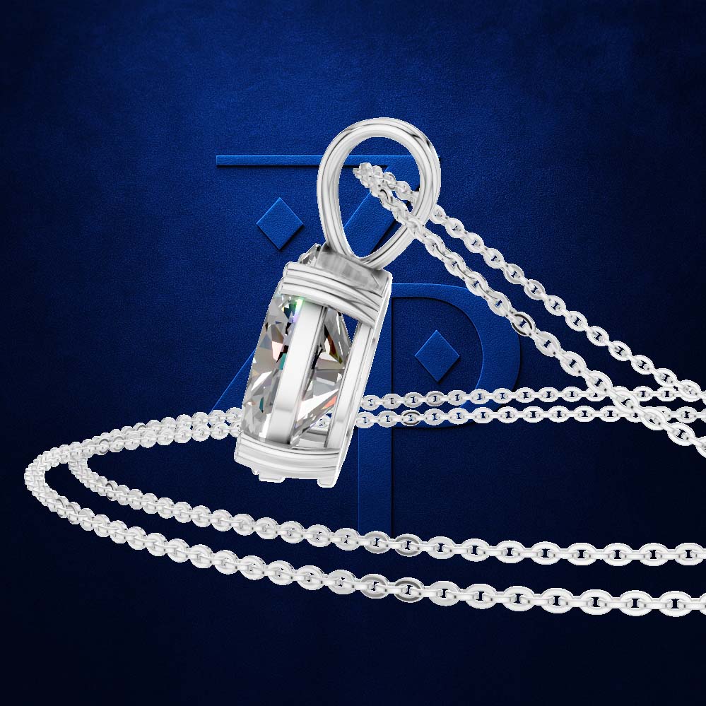 A silver-toned pendant necklace with a faceted clear crystal pendant and matching chain, displayed against a dark blue textured background with a stylized blue letter backdrop.