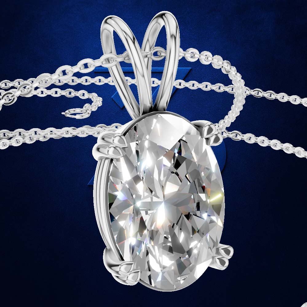 A silver-toned oval pendant necklace with a large clear faceted gemstone, shown on a dark blue background. The pendant is suspended from a delicate chain that loops around the top of the bail.