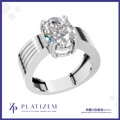 A silver-toned oval solitaire engagement ring with a brilliant round-cut clear gemstone, shown on a white background with the brand name 'PLATIZEM' at the bottom.