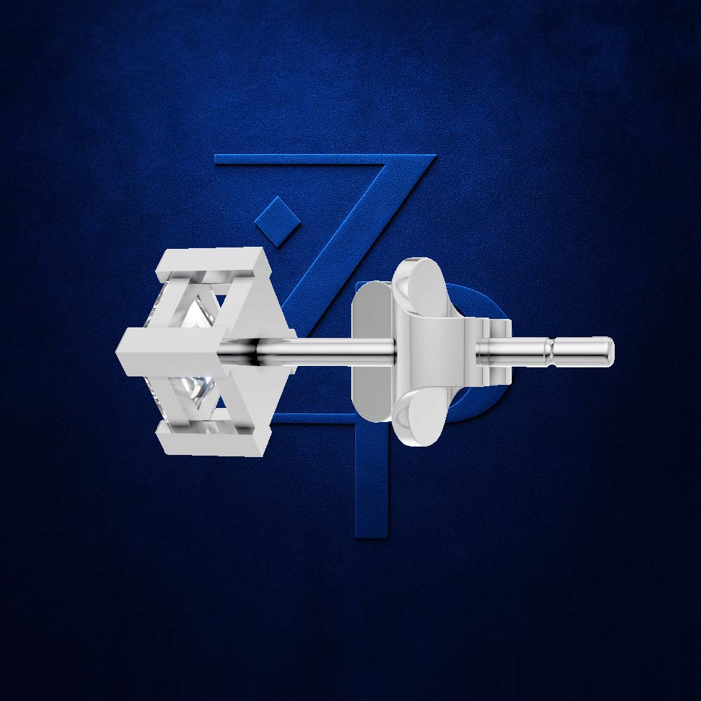 A pair of silver-toned geometric stud earrings shown from the side against a dark textured blue background with a subtle blue stylized 'Z' logo behind them.