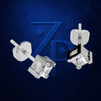 A pair of silver-toned square stud earrings with clear gemstones, shown from different angles against a textured dark blue background with a large stylized 'ZP' logo.