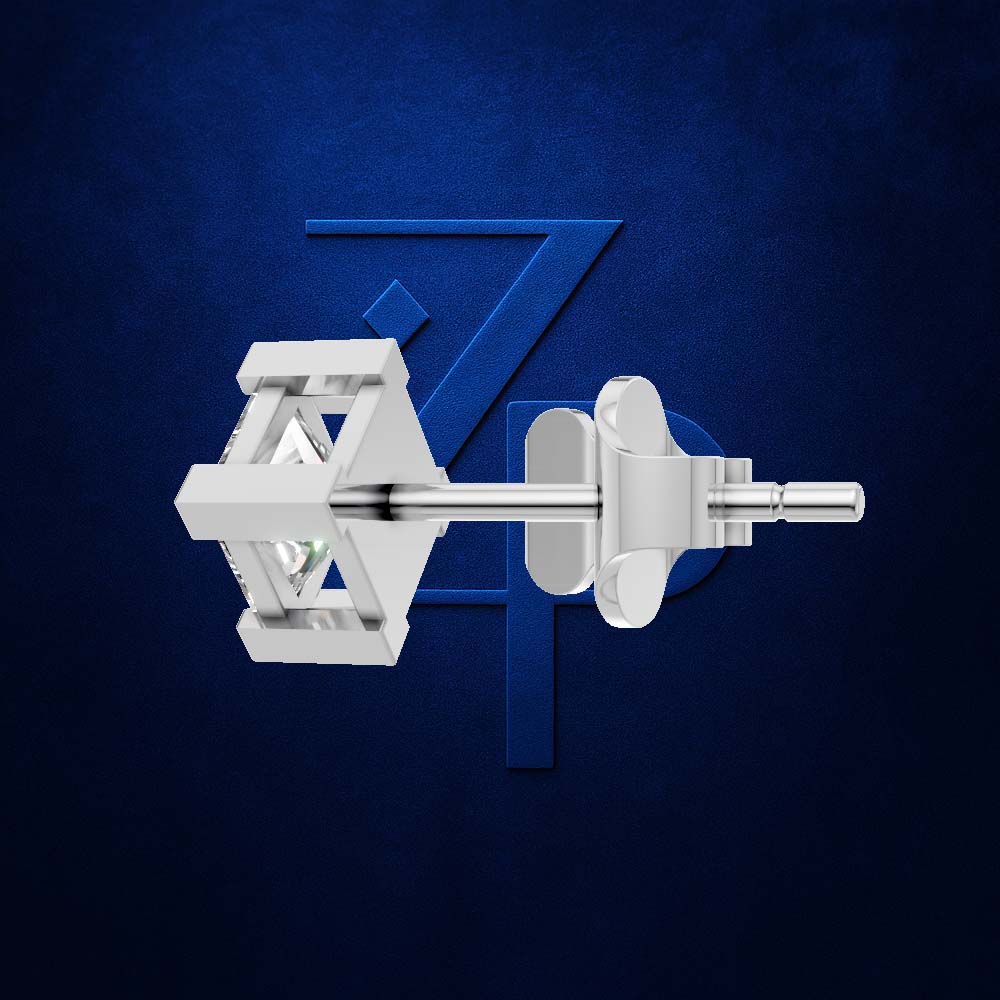 A pair of silver-toned geometric stud earrings shown against a dark textured blue background with a large stylized blue 'Z' behind them.
