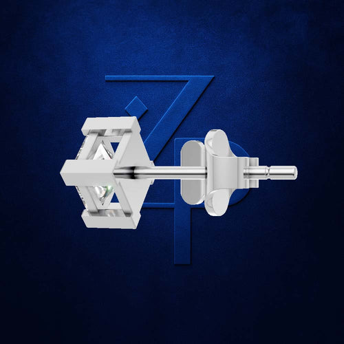 A pair of silver-toned geometric stud earrings shown against a dark textured blue background with a large stylized blue 'Z' behind them.