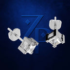 A pair of silver-toned geometric stud earrings with clear faceted crystal-like centers, shown floating against a dark blue textured background with a large stylized blue 'ZP' logo behind them.