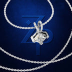 A silver-toned necklace with a geometric pendant featuring a clear gemstone, displayed against a dark blue background with a large stylized 'ZP' logo.