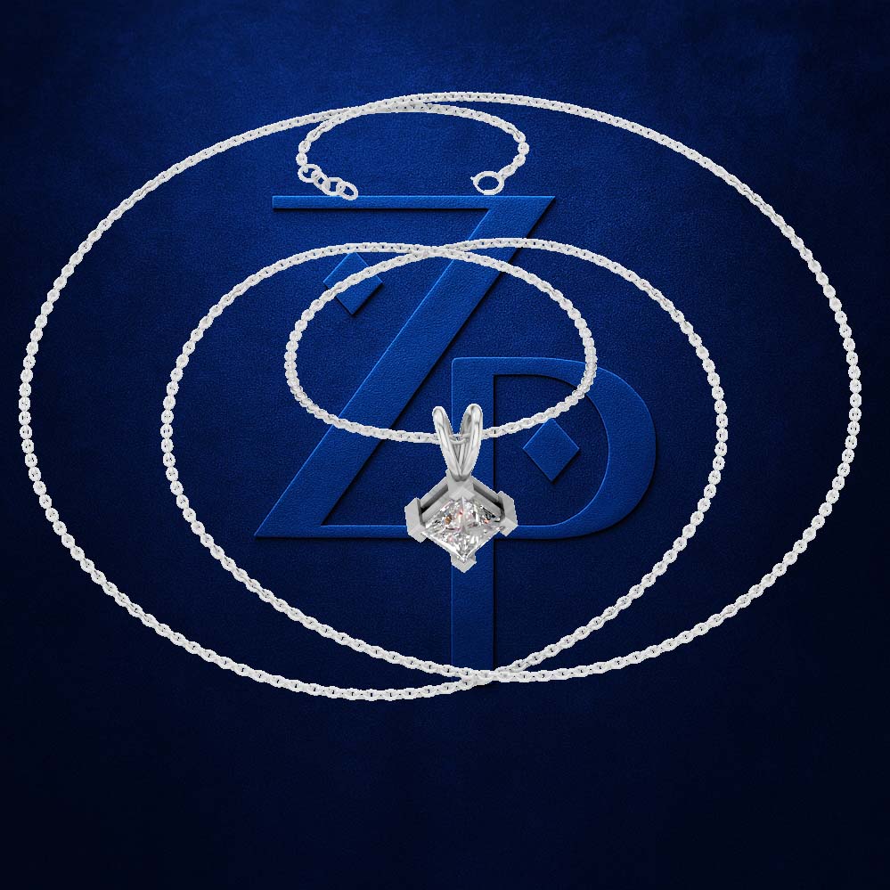 A silver-toned chain necklace with a geometric diamond pendant, arranged in concentric circles over a dark blue textured background with a large stylized 'ZD' logo.