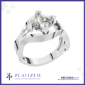 A silver-toned split-band ring with a square bezel-set clear gemstone, shown on a white background with the brand name PLATIZEM at the bottom.