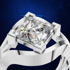 A close-up studio render of a silver-toned ring with a large clear rectangular gemstone on a dark blue textured background.