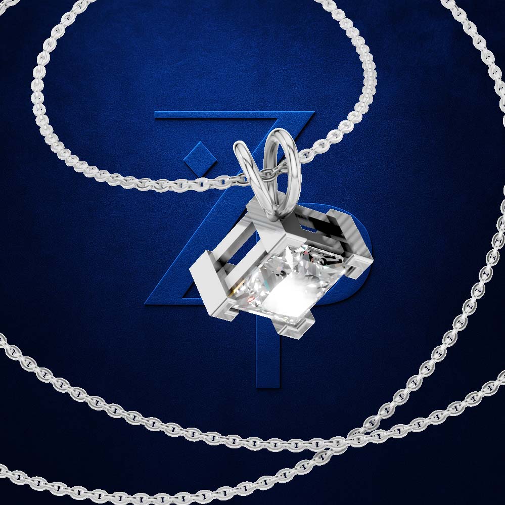 A silver-toned necklace with a geometric box-shaped pendant featuring a clear faceted gemstone, displayed on a textured dark blue background with a stylized blue logo.