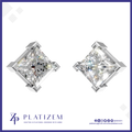 A pair of diamond-shaped stud earrings with brilliant clear gemstones in a silver-toned setting, shown on a white background with the brand name PLATIZEM at the bottom.