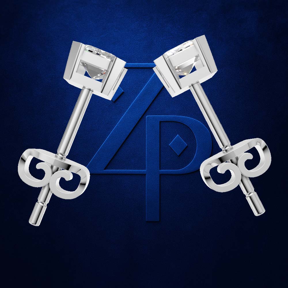 A pair of polished silver-toned earrings with clear rectangular gemstones and ornate scroll-shaped backings, arranged symmetrically on a dark blue textured background with a large blue monogram behind them.