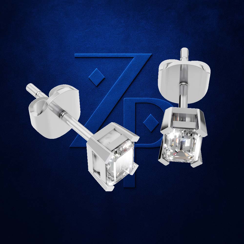 A pair of silver stud earrings with clear faceted gemstones, shown from front and side angles against a dark blue textured background with a subtle stylized logo.