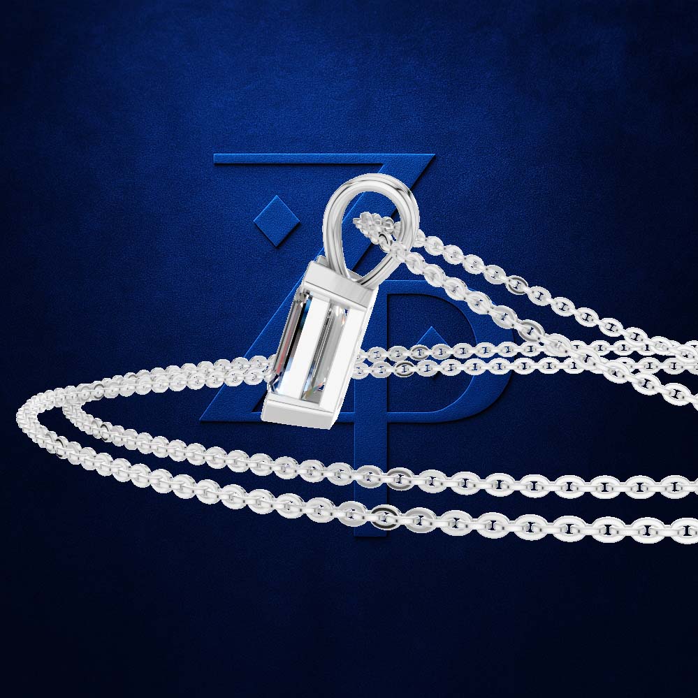 A silver-toned rectangular pendant necklace with a clear faceted center stone, shown on a dark blue textured background with a large blue monogram logo behind it.