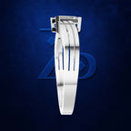 A white silicone watch band with a silver metal buckle, shown vertically against a textured dark blue background.