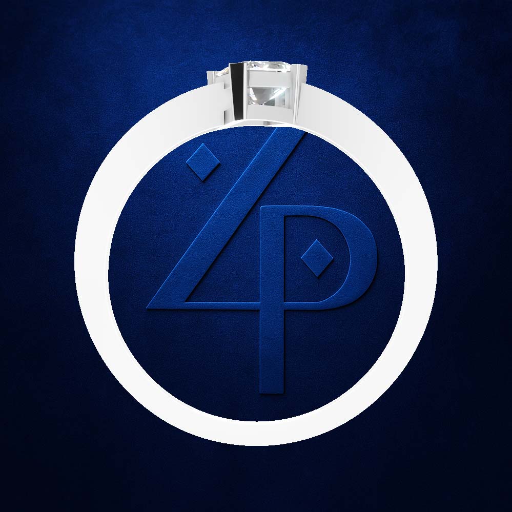 A silver-toned ring with a clear gemstone and a large white oval band featuring a blue embossed monogram logo, set against a dark blue textured background.