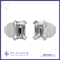 A pair of platinum stud earrings with emerald-cut clear gemstones, displayed on a white background with the brand name PLATIZEM at the bottom.