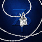 A silver-toned necklace with a square-cut clear gemstone pendant, shown on a dark blue textured background with a large stylized 'ZP' logo behind it.