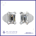 A pair of platinum stud earrings with emerald-cut clear gemstones, shown from the side on a white background with the brand name PLATIZEM at the bottom.