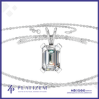 A silver-tone necklace with a large rectangular emerald-cut clear gemstone pendant, displayed on a white background with a branded logo banner at the bottom.