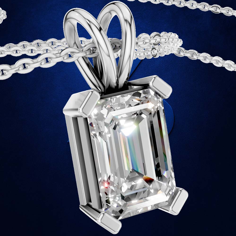 A silver pendant necklace featuring a large rectangular emerald-cut clear gemstone in a four-prong setting, suspended from a matching silver chain against a dark blue background.