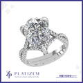 Pear Shape Diamond Ring Featuring a Twisted Shank and Hidden Halo Accent