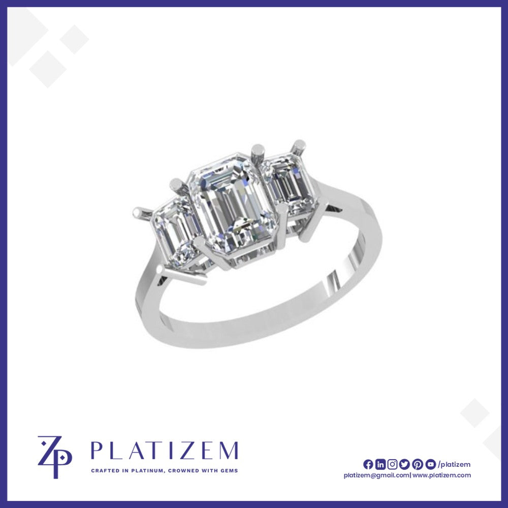 Three Stone Ring Pairing a Statement Emerald Cut with Matching Sides