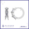 Emerald Cut Diamonds Line the Front of a Compact Prong Set Hoop