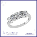 Five Bezel Set Emerald Cut Diamonds Lined Across a Clean Modern Band