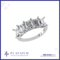 Five Emerald Cut Diamonds Set in a Row Across a Classic Prong Band