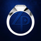 A close-up studio render of a ring with a polished silver-toned band and a large round brilliant-cut diamond setting, shown against a deep blue textured background. The center of the ring features a large blue monogram emblem.